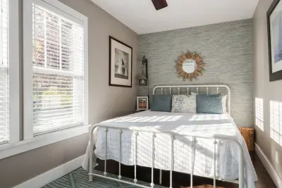 Charming Bedroom Retreat: Sunlit space with stylish decor and a comfy bed for peaceful nights!