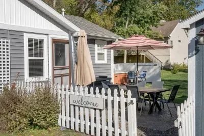 Patio Oasis: Enjoy alfresco dining under the umbrella with a spacious yard and welcoming vibes!