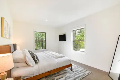 Serene King Retreat: Wake up refreshed with nature views and modern comforts right outside! Located on the main level for convenience.