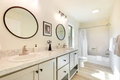 Large Bathroom: Elegant design with double vanity and natural light for a refreshing start!