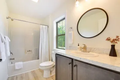 Bathroom Retreat: Enjoy natural light and elegant finishes for a refreshing spa-like experience!