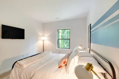 Queen Bedroom Oasis: Wake up to stunning forest views and modern decor in your perfect retreat!