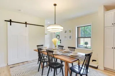 Dining Room: Gather around the stylish table and enjoy meals with a view of nature!