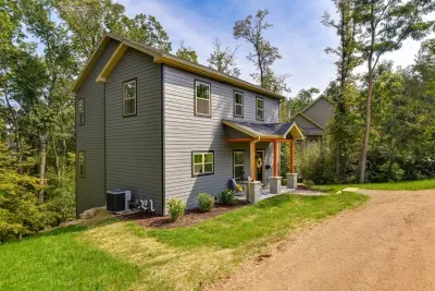 Exterior: Embrace nature with this modern retreat nestled among lush greenery!