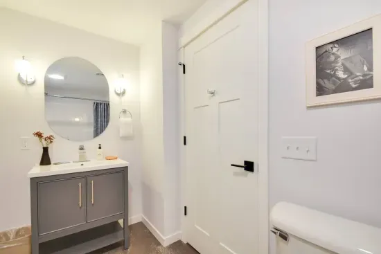 Charming Bathroom: Bright and airy with modern fixtures and a touch of artistic flair!