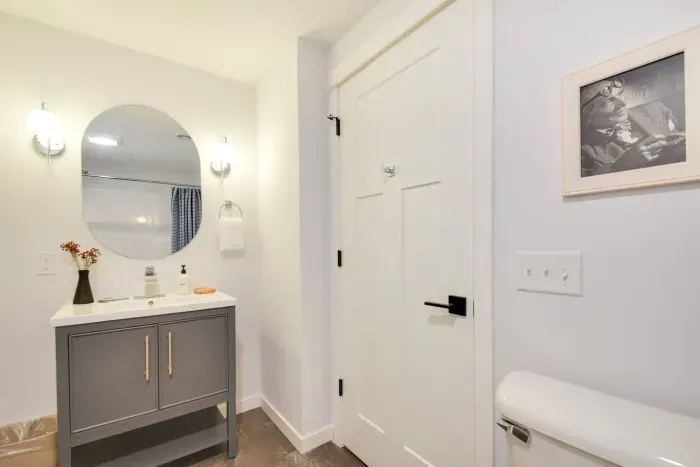Charming Bathroom: Bright and airy with modern fixtures and a touch of artistic flair!