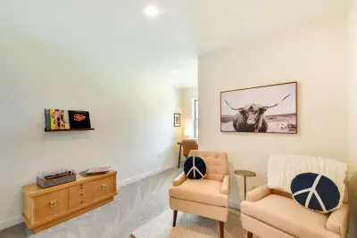 Charming Landing: Relax and unwind in a bright space with quirky decor, inviting seating & vintage vinyl!