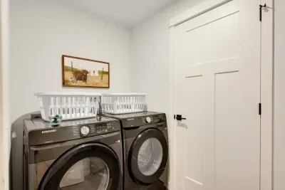 Laundry Room: Stay fresh on your getaway with modern machines and charming decor!