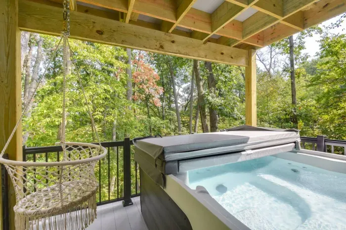 Outdoor Spa Retreat: Soak in the hot tub amidst stunning forest views and natural serenity!