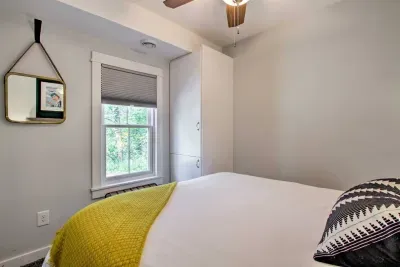 Charming Queen Bedroom Retreat: Bright room with a pop of yellow, perfect for restful nights and serene views - located on the main level!