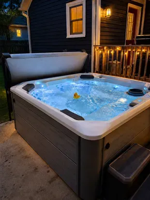 Outdoor hot tub at dusk