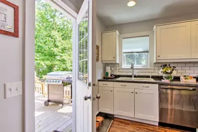 Kitchen Oasis: Bright and airy space with modern appliances and views that invite outdoor grilling!