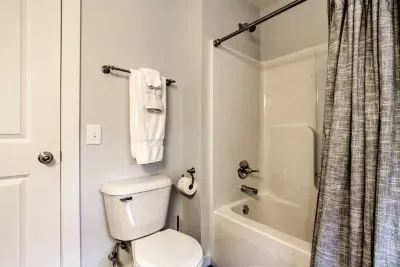 Refreshing Retreat on First Floor: Pristine bathroom with elegant finishes and luxurious towels for your comfort!