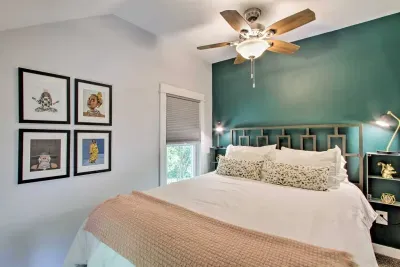 Charming Queen Bedroom Retreat: Vibrant decor and plush bedding invite relaxation and adventure!