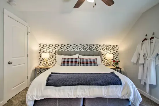 Charming King Bedroom Retreat: Modern decor, plush bedding, and a touch of rustic elegance await!