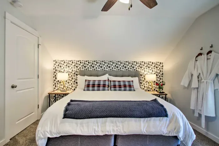 Charming King Bedroom Retreat: Modern decor, plush bedding, and a touch of rustic elegance await!