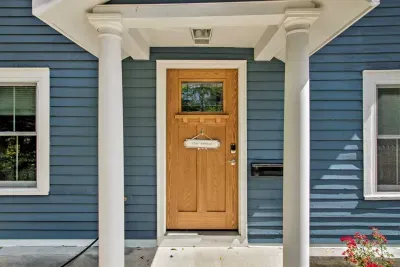 Charming Entrance: Step into your getaway with this inviting door and vibrant blue exterior!