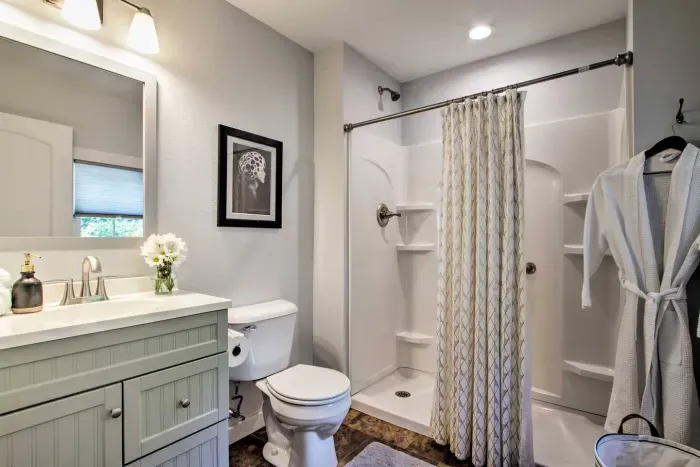 Main Level Bathroom Retreat: Bright space with modern fixtures and walk-in shower for your pampering pleasure!