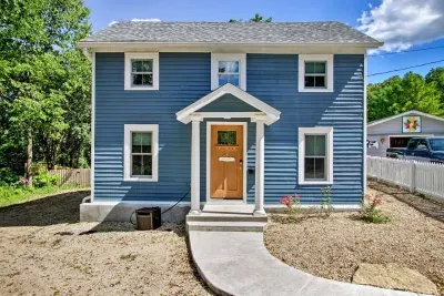 Cottage Core Exterior: Bright blue façade welcomes you to your Galena getaway—blink and you’ll be in nature!
