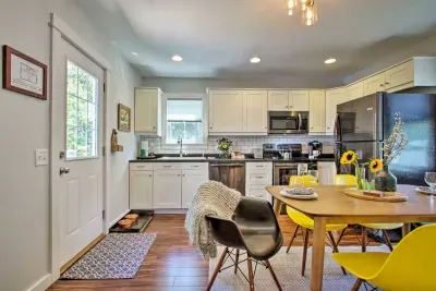 Charming Kitchen: Bright space with modern appliances and playful yellow accents for delightful meals!