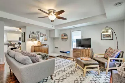 Living Room Retreat: Relax on chic furnishings surrounded by vibrant decor and warm lighting!