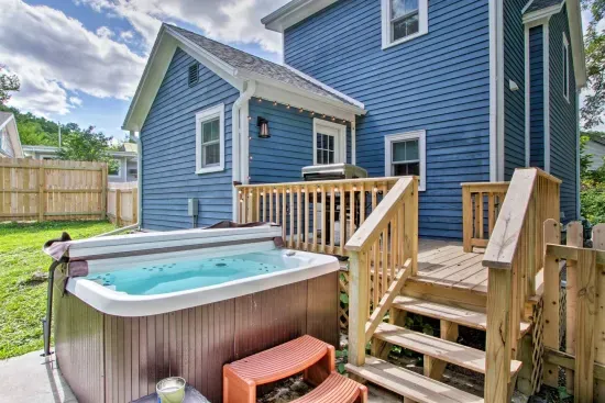 Outdoor Oasis: Unwind in the hot tub while enjoying the scenic views of Galena's charm!
