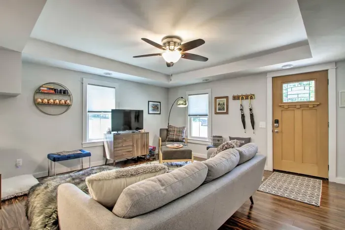 Living Room: Stylish setting with a plush sofa, bright windows, and unique decor to unwind!