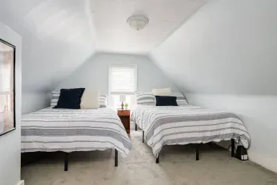 Attic Retreat: Twin beds and skylight views create the perfect hideaway for fun-filled getaways!