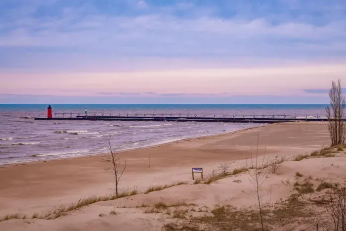 Scenic View: Wake up to stunning sunsets overlooking the iconic South Haven lighthouse!