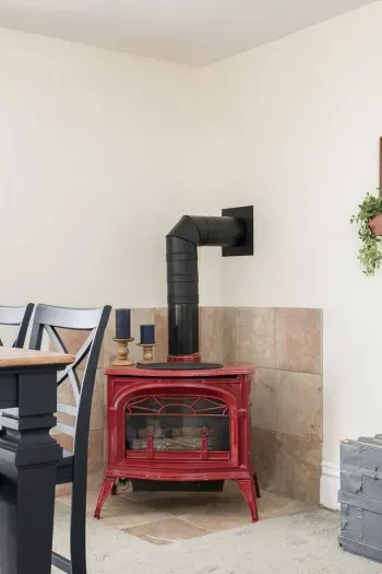 Living Room: Enjoy gatherings by the stylish red stove, perfect for warm, inviting moments together!