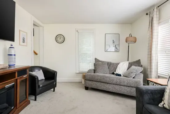 Living Room: Bright and airy space with plush seating, perfect for relaxation and gathering!