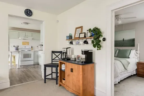 Charming Interior: Bright open space with coffee corner, coastal vibes, and inviting decor await!