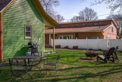 Outdoor Space: Enjoy fun barbecues and s'mores by the fire pit in your spacious backyard!