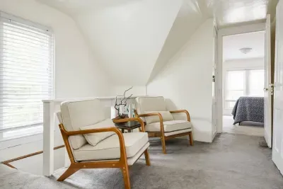 Attic Lounge: Unwind in style with plush seating and serene views of South Haven!