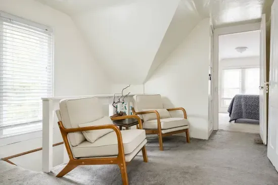 Attic Lounge: Unwind in style with plush seating and serene views of South Haven!