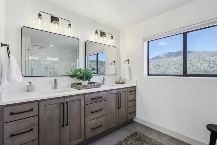 Spa-Inspired Retreat: Enjoy mountain views from this stylish bathroom with modern fixtures!