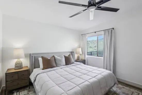 Elegant King Retreat: Bright bedroom with stunning views, inviting decor, and soothing ambiance awaits!