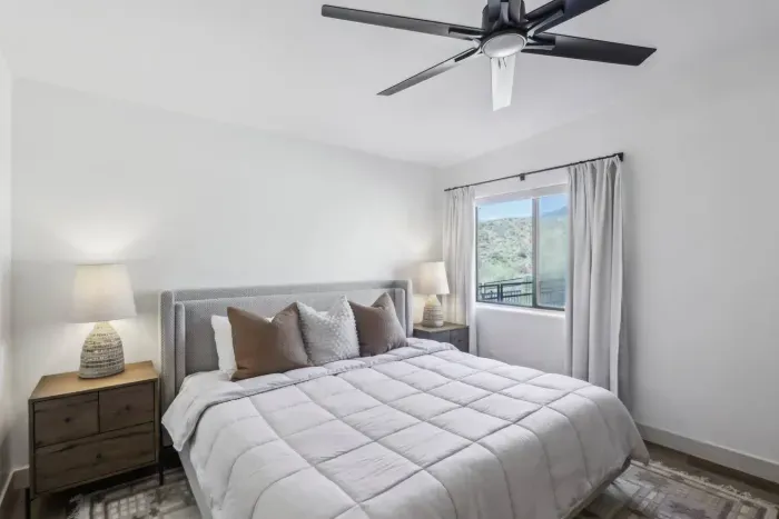 Elegant King Retreat: Bright bedroom with stunning views, inviting decor, and soothing ambiance awaits!