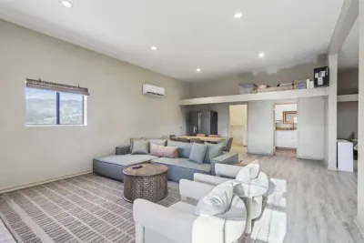 Guest House Living Room: Bright and airy space with modern decor, perfect for relaxing after your adventures!