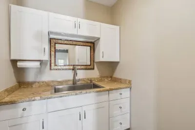 Guest House Kitchenette: Whip up meals in style with modern finishes and ample counter space!