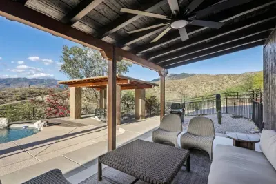 Outdoor Lounge: Savor stunning mountain views from this stylish shaded patio retreat!
