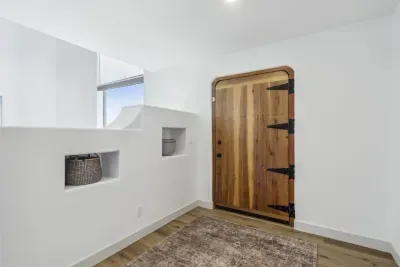 Entrance: Welcoming gateway with rustic charm and natural light, setting the tone for your retreat!