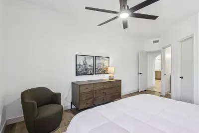 Bedroom Retreat: Tranquil tones, modern decor, and lush desert views await your relaxation!