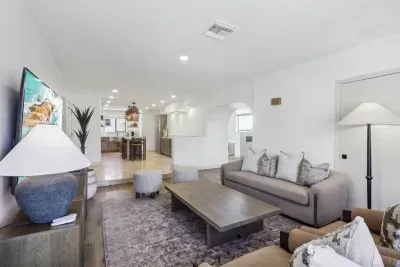 Living Room: Stylish decor, ample natural light, and open layout perfect for relaxation and fun!