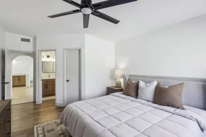 King Bedroom Suite: Relax in style with a plush bed, modern decor, and bright natural light!