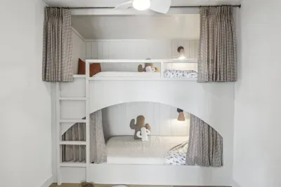 Bunk Room: Adventure awaits in playful bunks with quirky decor and cozy lighting!