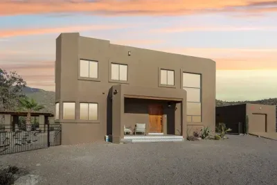 Exterior: Explore modern architecture with stunning mountain views and a welcoming entrance!