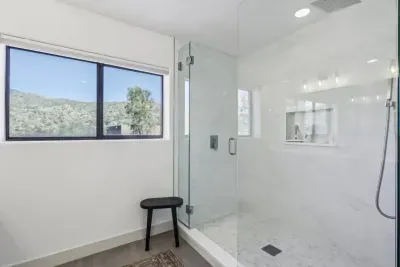 Spa-Like Retreat: Huge, modern tile shower and serene mountain views for your relaxation.