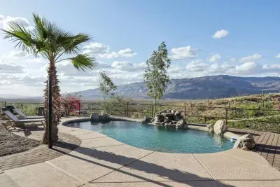 Outdoor Oasis: Dive into views of sprawling desert vistas from your private pool paradise!