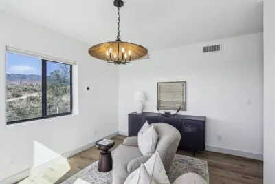 Living Room Retreat: Enjoy vibrant views and stylish decor in this sunlit escape!